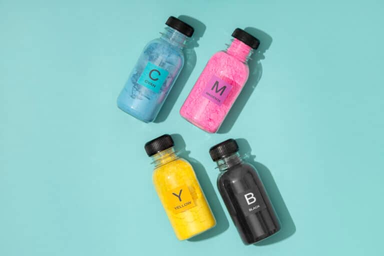 three bottles with different colored liquids in them